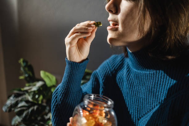 cbd-cannabis-gummy-woman-eating